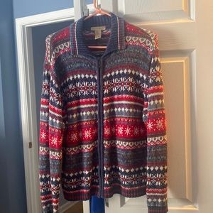 Winter design sweater that zips in the front.